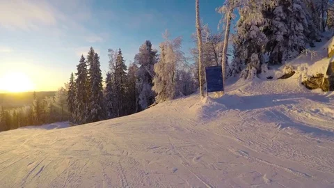 Alpine skiing on beautiful sunset, riding down the piste of skiing resort. Stock-Footage 71261889