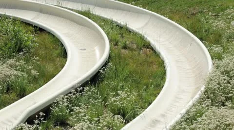 Alpine sled slide through mountain wild flowers HD 2735 Stock Footage 11744689