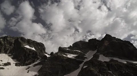 Alpine Snowy Peak Clouds Timelapse 4K Stock Footage 64771642