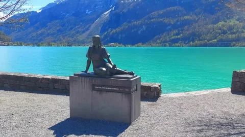 Alpine Statue with Turquoise Lake and Blue Sky, Brienz 4K Stock Footage 341279685
