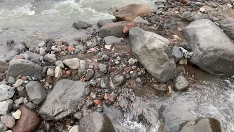 Alpine stream with clear water. Drinking water pours over the stones Stock-Footage 140523425