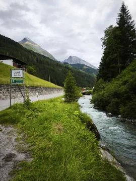 Alpine Stream Path Yellow Sign Mountains Stock Photos