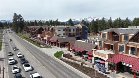 Alpine-style shops and timber-frame buildings with outdoor dining and Stock Footage 337453623