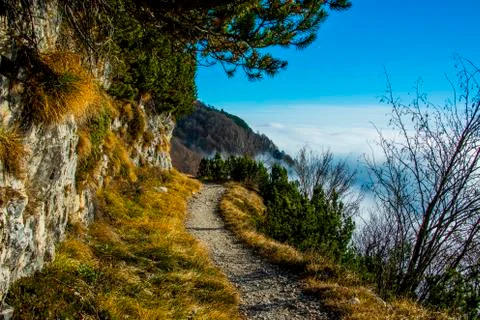 Alpine trail in the clouds two Stock Photos