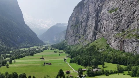Alpine Valley steep cliff face Lauterbrunnen Valley Switzerland drone,aerial Stock Footage 314271289