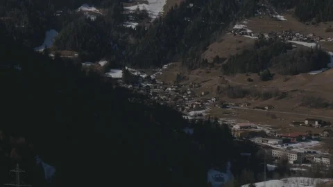 Alpine village in the shadow of the mountains Stock Footage