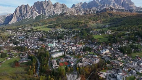 Alpine village under a mountain range in the center of a valley. Stock Footage 221187992