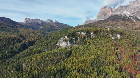 Alpine village under a mountain range in the center of a valley. Stock Footage 221188308