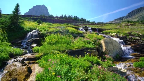 Alpine Waterfall Cascades In Mountains Video stock 230013327