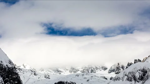 Alpine winter clouds time lapse Stock Footage 64968583