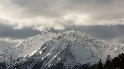 Alpine winter clouds time lapse Stock Footage 64972175