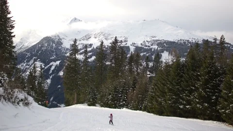 Alpine winter landscape, below you can see the figure of a skier, moving down Stock Footage 100604929