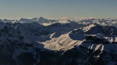 Alpine winter landscape, mountains ridges covered in clouds Stock Footage 46132262