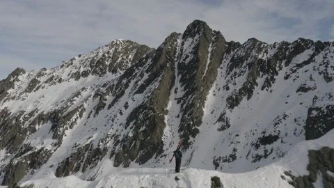 Alpinist on the top of a mountain Stock-Footage 100876187