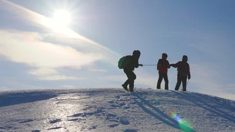Alpinists team in winter down rope from the mountain. well-coordinated teamwork Stock Footage 111188202