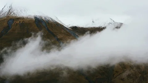 Alps in the clouds. Snow tops Stock Footage 122826795