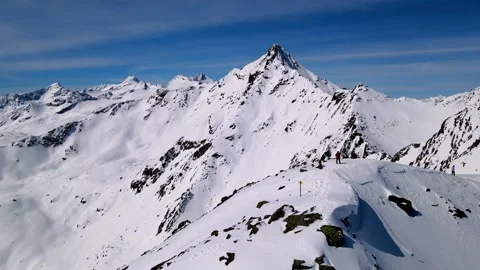 Alps | Skiier on the top of the mountain - circle video Stock Footage 255730028