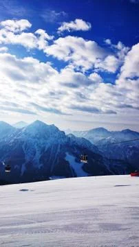 Alps, snow, sun, mountains, cabla car Stock Photos