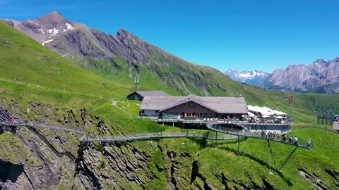 Alps viewing platform Drone Pan view with green mountains in the background Stock Footage 246983996