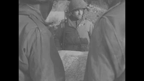 ALSDORF, GERMANY - 1944: Map portrait - An officer holds a map Stock Footage 344006069