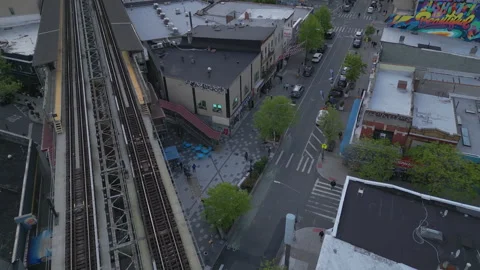 Alt aerial pullback revealing elevated subway track in Bushwick Brooklyn Stock-Footage 240307834