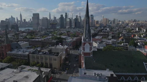 Alt curving past front of  iconic church in Greenpoint Brooklyn Vídeos de archivo 250162571