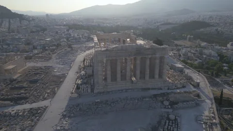 Alt day flying counter clock back from Parthenon atop Acropolis in Athens Greece Video stock 248581191
