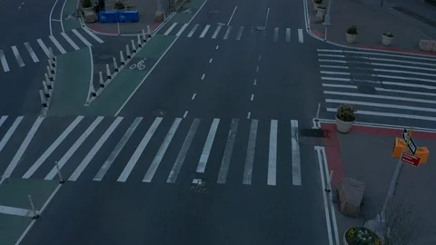 Alt flying south tilting up on empty street to Flatiron bldg NY Covid quarantine Stock Footage 127198904