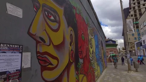Alt walking past graffiti wall in downtown Bogota Stock-Footage 81463134