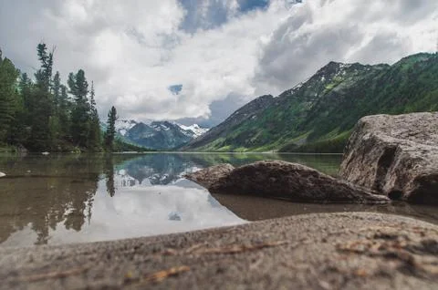 Altai Mountain. the second multi-million lake. View from below horizontally Stock Photos