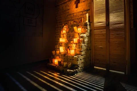 An altar with burning candles. Stock Photos