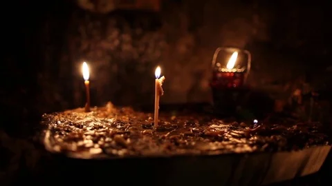 Altar with burning Candles in St. Simon the Zealot's apostle cave 库存影片 85047442