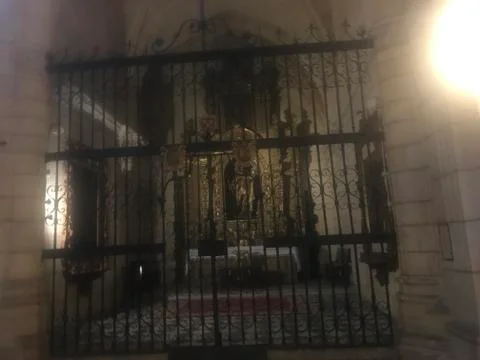 Altar from outside through a gate Stock Photos