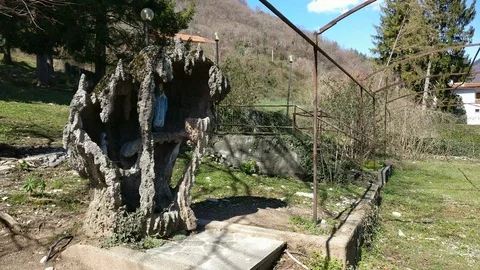 Altar with Virgin Mary inside a small domestic cave Stock Footage 91026355
