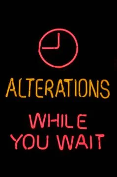 Alterations while you wait neon sign Stock-Fotos