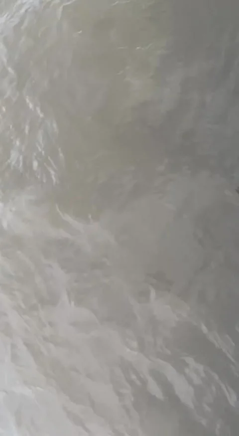 Altering light of sunbeams in muddy water Stock Footage 294173302