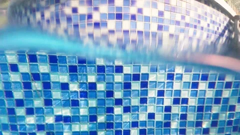 Alternating above‑surface and underwater views at swimming pool wall Stock Footage 344832006