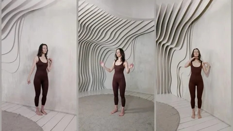 Alternating postures: sitting, lying, on the floor. Burgundy jumpsuit   Vídeo Stock 313875741