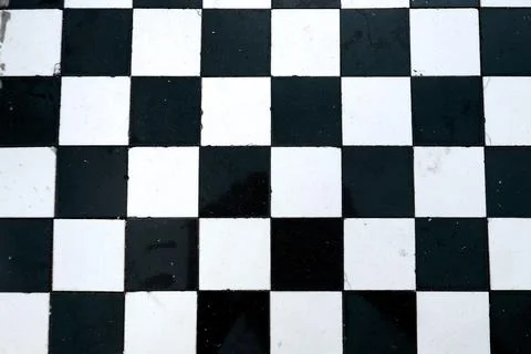 Alternating square floor tiles create a striking checkerboard pattern Stock Photos
