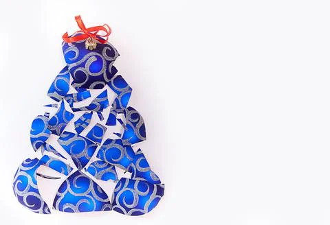 Alternative Christmas tree made of a broken Christmas ball on a white background Stock Photos