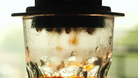 Alternative coffee brewing process using aeropress. Simple steps for a delicious Stock Footage 237804599