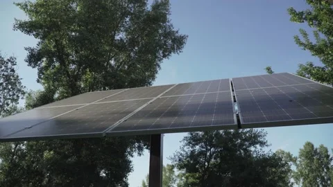 Alternative energy sources theme. Small solar panel in sunny weather in the park Stock Footage 152154818