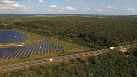 Alternative energy. Vast fields of the large solar power station and highway  Stock Footage 120308125