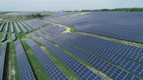 Alternative energy, view of solar panels in field from height Video stock 96311596