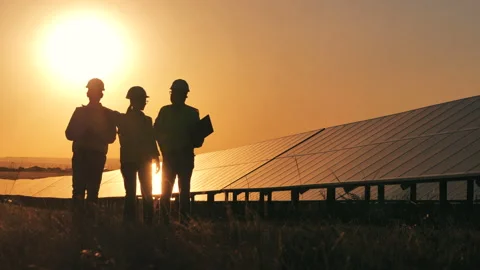 Alternative, green energy worker. Three solar energy specialists inspecting a Stock Footage 144248802