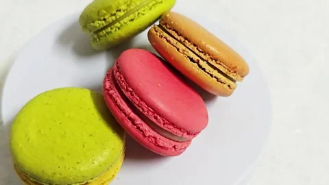 Alternative high angle view of assorted colorful French macarons. Stock Footage 347488020