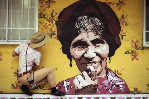 Alternative hipster with hat dances with graffiti street art in Mexico Stock Photos