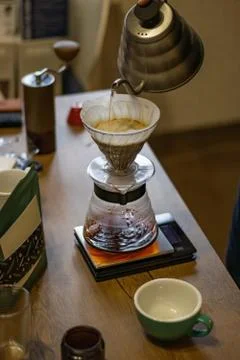 Alternative manual coffee brewing method. Transparent glass pour over dripper Stock Photos