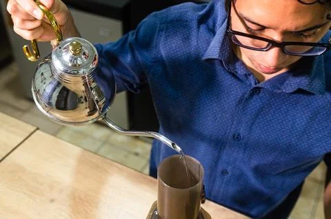 Alternative method of making aeropress coffee, thick foam on the surface of the Stock Photos