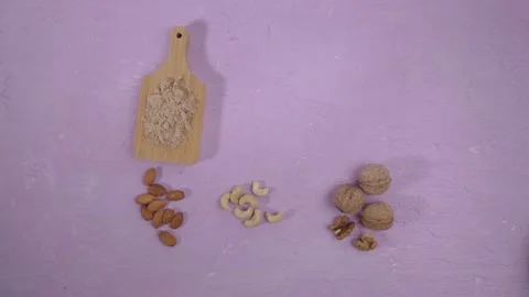 Alternative nut flour. Vegan baking. Almond, walnut, cashew flour. Flat lay Stock Footage 171308565